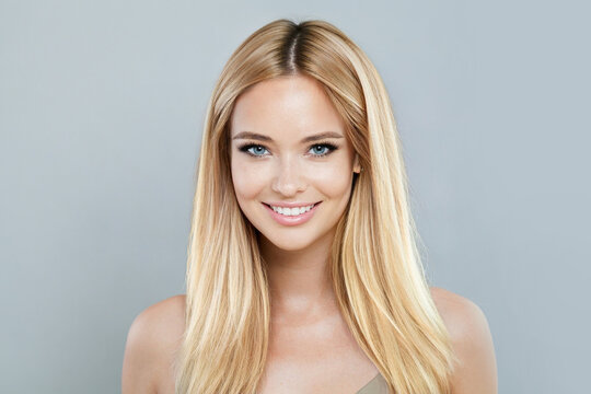 Blonde model woman with natural make-up, healthy skin and long hair. Female beauty, cosmetology and skincare concept