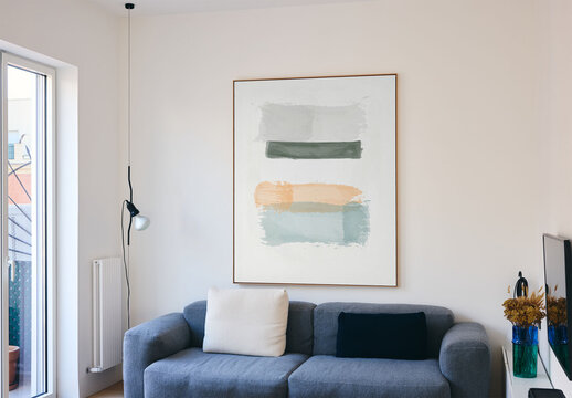 Mockup of vertical customized picture frame on wall in room