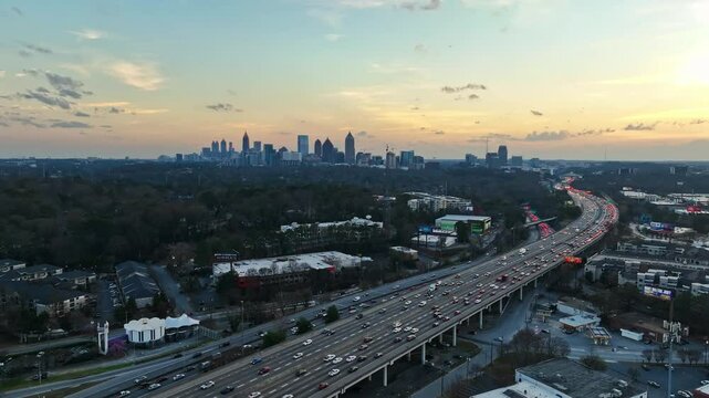 Busy Highways During Rush Hour At Dusk In Atlanta, Georgia. Downtown Skyline In Distance. wide aerial, static shot