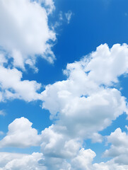 Puffy white clouds drifting across a bright blue sky on a sunny day