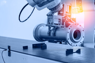 CNC AI robot arm with gripper in factory, robotics hand moving pipes along conveyor belt