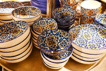 set of ceramic dishes with multi-colored patterns. souvenir ceramic tableware