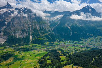 Obraz premium View on the alpine valley Grindelwald. Jungfrau, Switzerland. Under the Bernese alps. Mountain village.