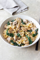 Farfalle pasta with mushrooms and spinach. Healthy eating. Vegetarian food.
