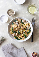 Farfalle pasta with mushrooms and spinach. Healthy eating. Vegetarian food.
