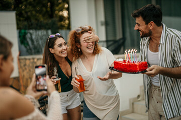 Group of friends celebrating a birthday together. Party, holidays, happiness, fun and people concept