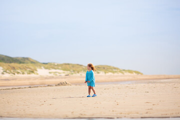Kids playing on beach. Children play at sea.