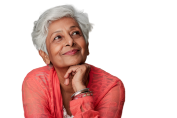 Elderly Indian woman looking up, thinking, and feeling hopeful with an idea.