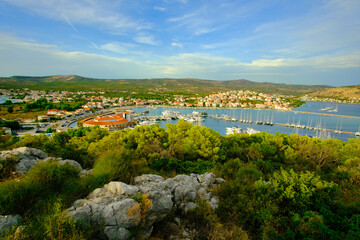 A beautiful view of a town with a large body of water in the background