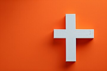 Obraz premium Cross Against an Orange Background