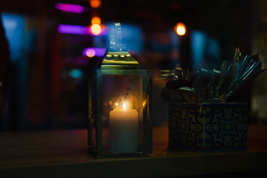 festive candle in a pub window
