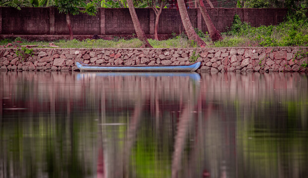 Canoe stationed along the kochi backwaters in the indian state of Kerala. Conoe is the traditional way to move around for the local people.