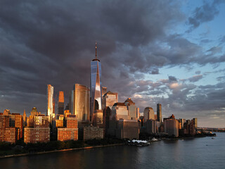 NYC aerial view, New York City Skyline with dramatic sky. Panoramic drone view on Manhattan in NY. Sunset in NYC.