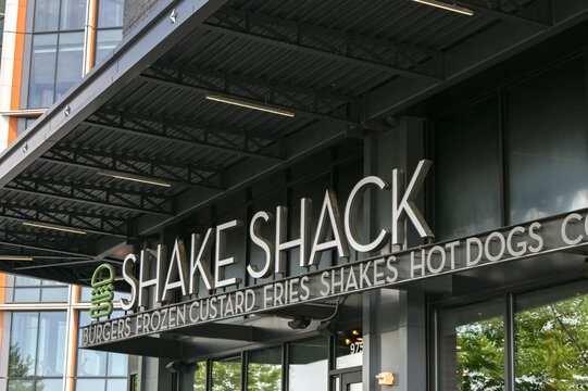 Washington DC, USA - 30 April 2024: Sign above the entrance to a branch of the Shake Shack chain of burger restuarants.