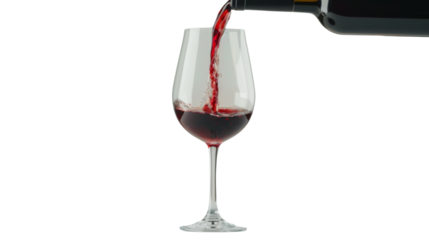 Red wine pouring in glass on white background
