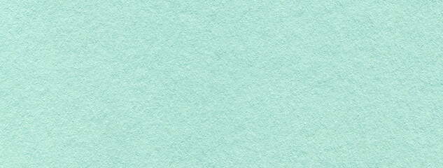 Texture of craft light cyan paper background colors, macro. Structure of vintage kraft blue cardboard.