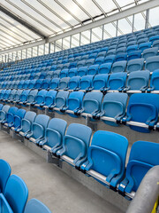 Fototapeta premium empty blue tribunes? seating rows in a stadium