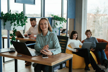 Fototapeta premium Positive and cheerful mood. People are working in the office with bean bags chairs in it