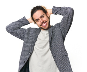 Young businessman in casual blazer stretching arms, relaxed position.