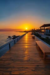 the sun is setting over the water on a pier