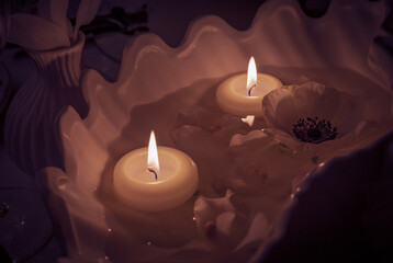 the burning candle on a  table