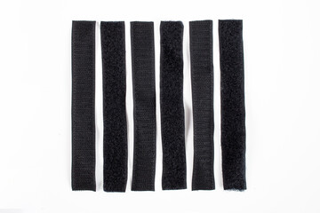 Velcro sticky tape strips pairs isolated on white background, flat lay close up
