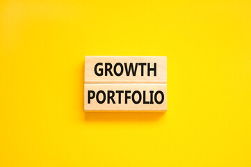 Growth portfolio symbol. Concept words Growth portfolio on beautiful wooden block. Beautiful yellow paper background. Business Growth portfolio concept. Copy space.