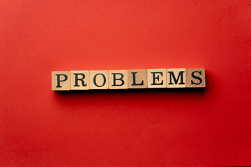 Obraz premium a yellow warm background without shadows wooden cubes with black letters laid out word problems