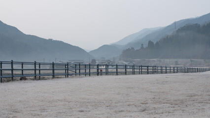 landscape with fence and mountains