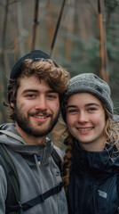 Happy Adventurers in Nature Young Couple Smiling in Outdoor Gear, Enjoying a Hiking Trip in a Beautiful Forest Setting with Backpacks and Winter Clothing, Cheerful Moments in Nature