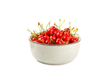 Cherry in a bowl isolated. Fresh ripe cherries with leaves isolated on a white background.Sweet cherries pile. Berries and fruits. Vegan. Healthy eating.