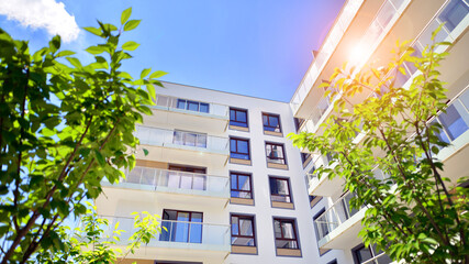 European residential architecture harmonizing with nature. Eco-friendly living in city with greens. Eco apartment building saving energy and fresh air concept. 