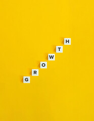 Growth Word and Banner. The Development Concept of Economics. Letter Tiles on Yellow Background. Minimal Aesthetics.