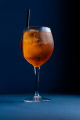 Glass of Aperol Spritz with ice. Trendy summer drinks