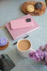 Pink diary and smartphone on the table