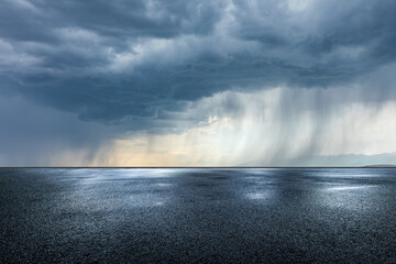 Asphalt road with black rain clouds natural landscape before the rainstorm