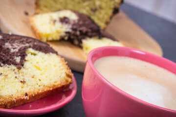 Coffee with milk and fresh baked yeast dough with cocoa for different festive occasions. Delicious dessert