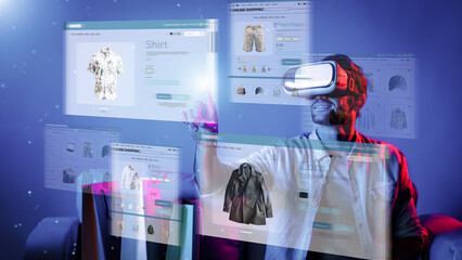 Caucasian man choosing and selecting product for shopping list while wearing visual reality goggles. Skilled person sitting at sofa with shopping bags while using VR glasses. Technology. Deviation.