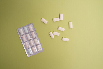 A package of chewing gum on a colored background. Place for text. Healthy teeth and hygiene concept