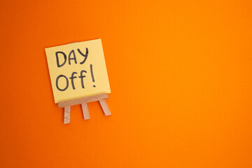 Day off - workplace message in the office. Concept of absence from work and day off

