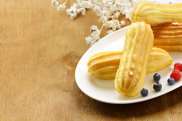 traditional choux pastry eclair dessert on a plate