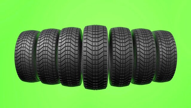 A row of automobile tires, on a chroma green background, 3d animation
