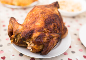 Whole roasted chicken on a plate