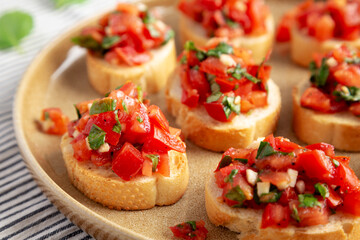 Homemade Italian Tomato Bruschetta on a Plate, side view. Close-up.