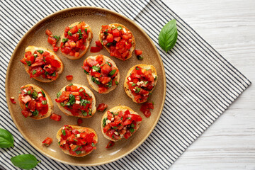 Homemade Italian Tomato Bruschetta on a Plate, top view. Flat lay, overhead, from above.