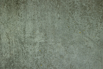 Obraz premium Texture of a gray concrete wall with adhered dirt and moss