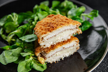 cutlet cordon bleu chicken meat, ham, cheese natural fresh appetizer meal food snack on the table copy space food background rustic top view
