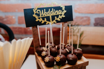 An assortment of beautifully arranged desserts, featuring vibrant fruits and delicate garnishes, perfect for a wedding celebration
