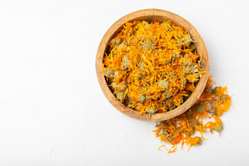 Assortment of dry herbal and berry tea on a wooden background. Tea party concept. medicinal herbs. Healing herbs.Alternative medicine.Linden, calendula, cornflowers, marigold, tansy, tea rose.