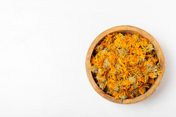 Assortment of dry herbal and berry tea on a wooden background. Tea party concept. medicinal herbs. Healing herbs.Alternative medicine.Linden, calendula, cornflowers, marigold, tansy, tea rose.